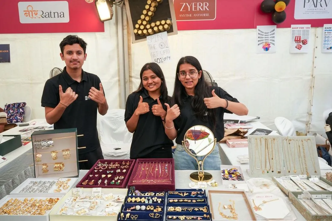 Students at a jewellery stall