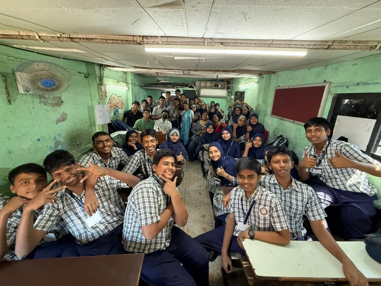 Mesa students with school children at a Teach For India classroom