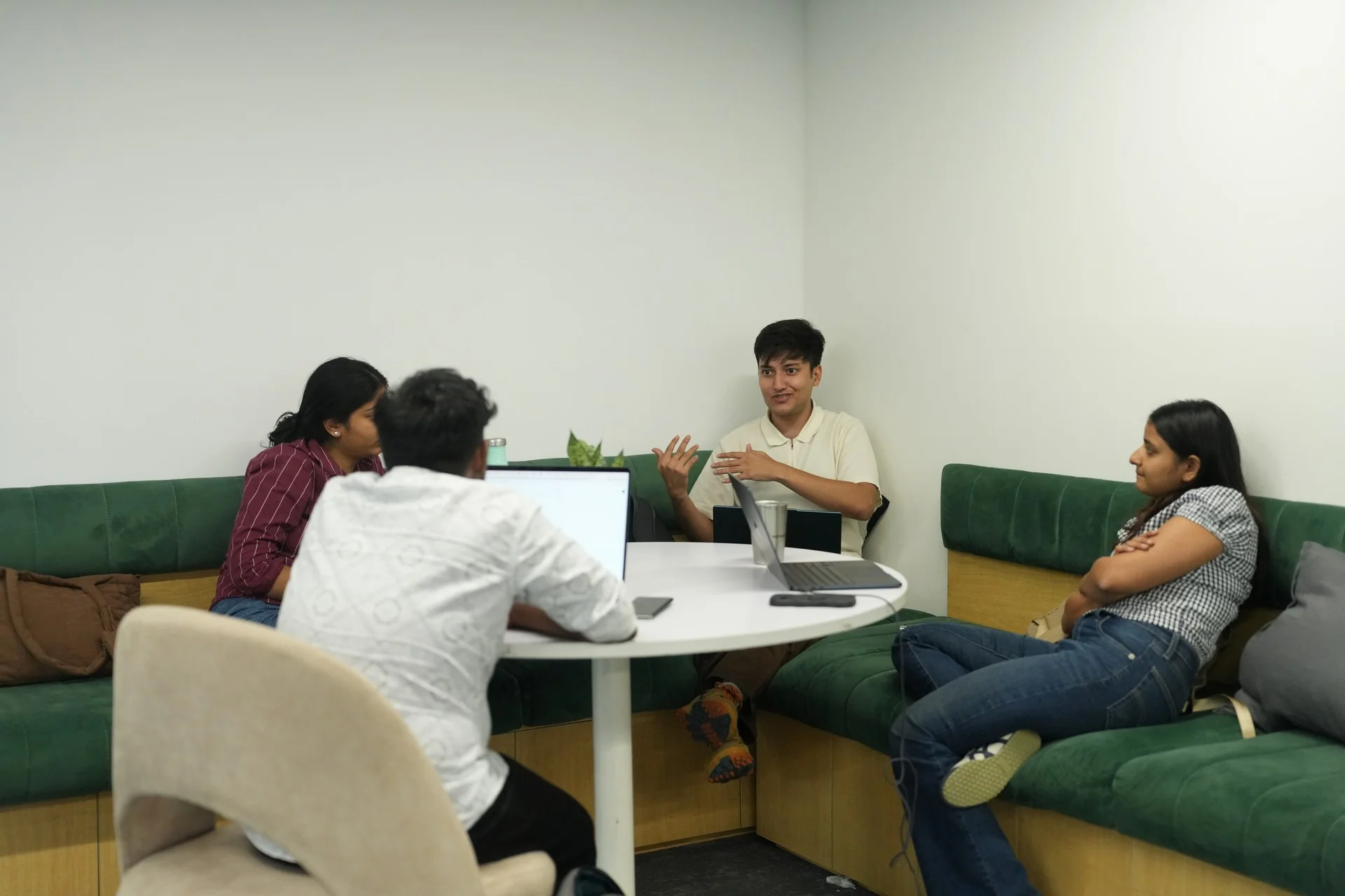 Students talking in a booth in the lounge