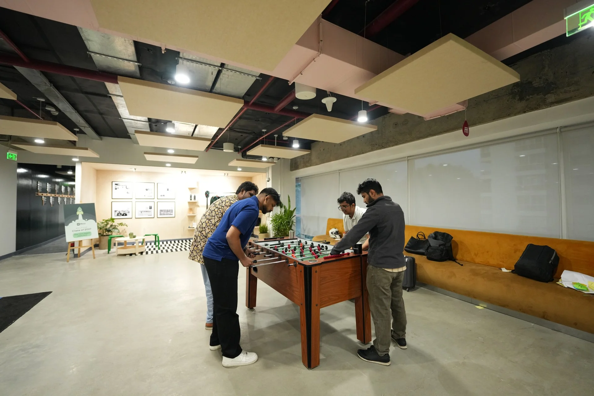 Students playing foosball on campus